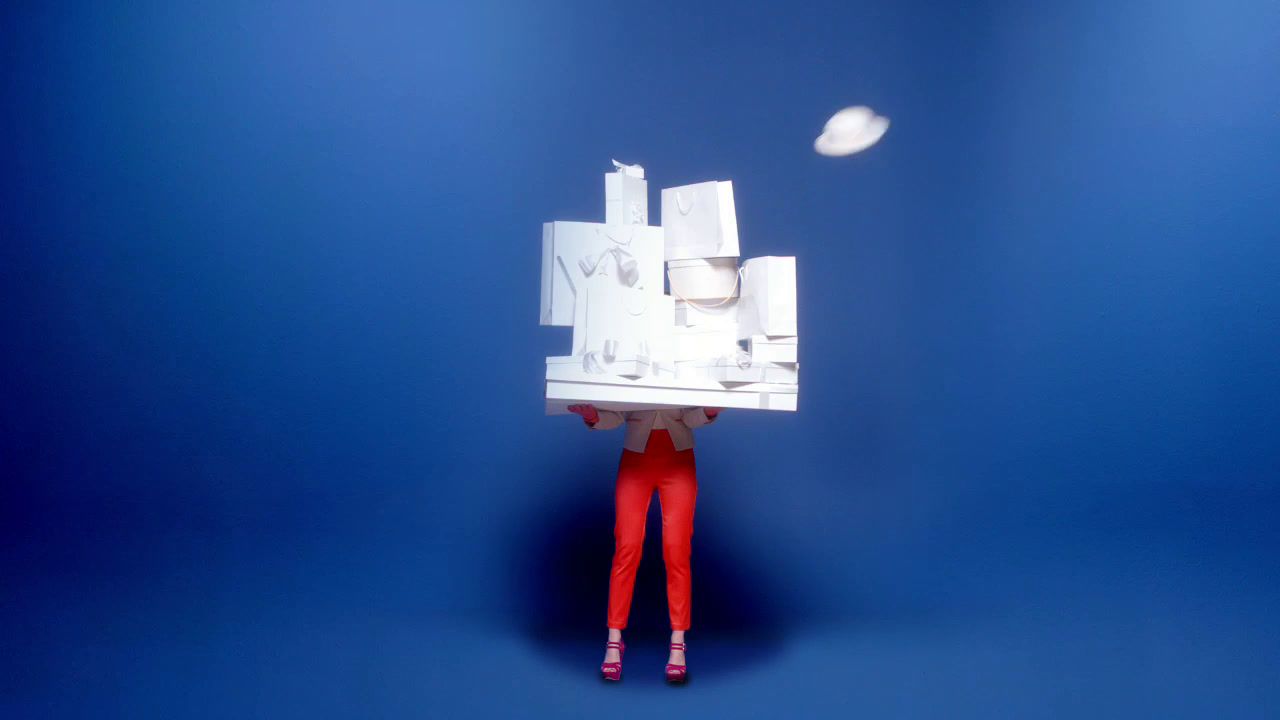 a person in red pants holding a white object