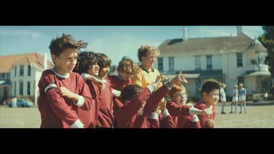 a group of young boys standing next to each other