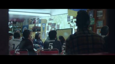 a group of people sitting at a table in a room