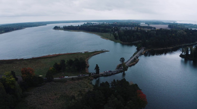 a large body of water surrounded by trees