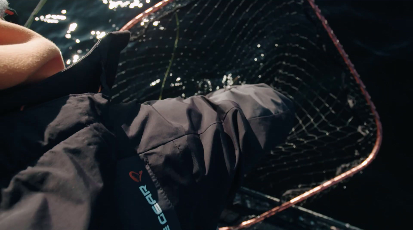 a close up of a person holding a fishing net