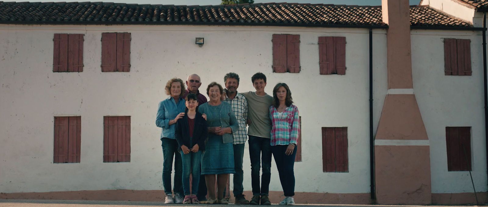 a group of people standing in front of a building