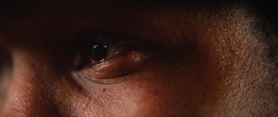 a close up of a person's eye with a blurry background