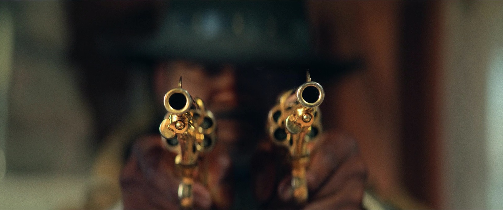 a close up of a person holding a gun