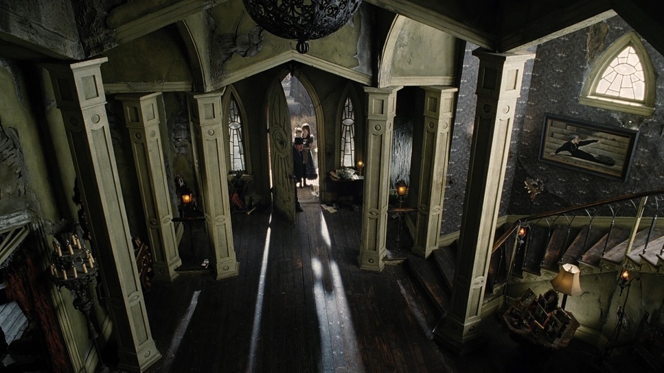 a hallway in a house with a clock on the wall