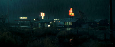 a night scene of a gas station with a neon sign