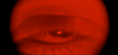 a blurry image of a red object in the dark