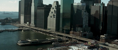 a view of a large city with a bridge in the middle of it