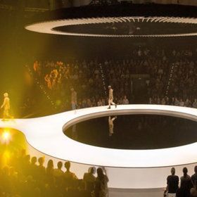 a group of people standing on top of a stage