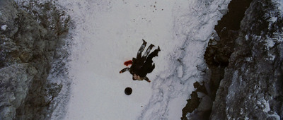 an aerial view of a person on a snowboard