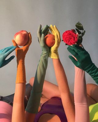 a group of people with their hands in the air