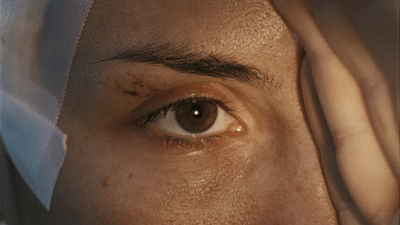 a close up of a person with a bandage on their head