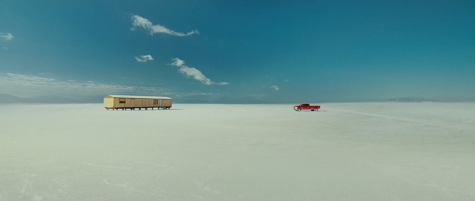 a couple of trailers that are sitting in the snow