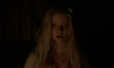 a woman with long blonde hair and blood on her face