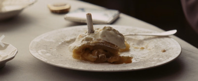 a white plate topped with a piece of pie