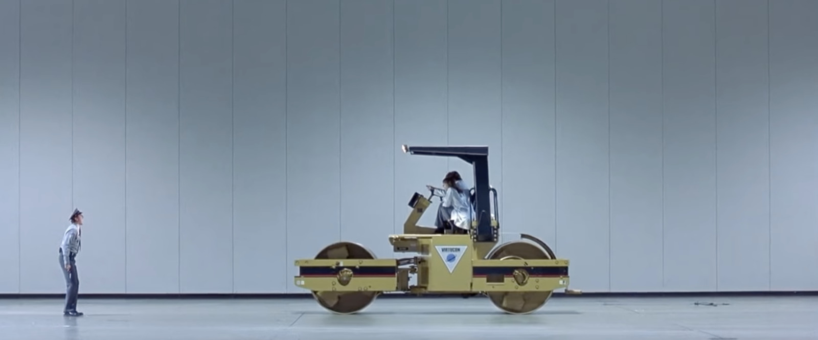 a man standing in front of a fork lift