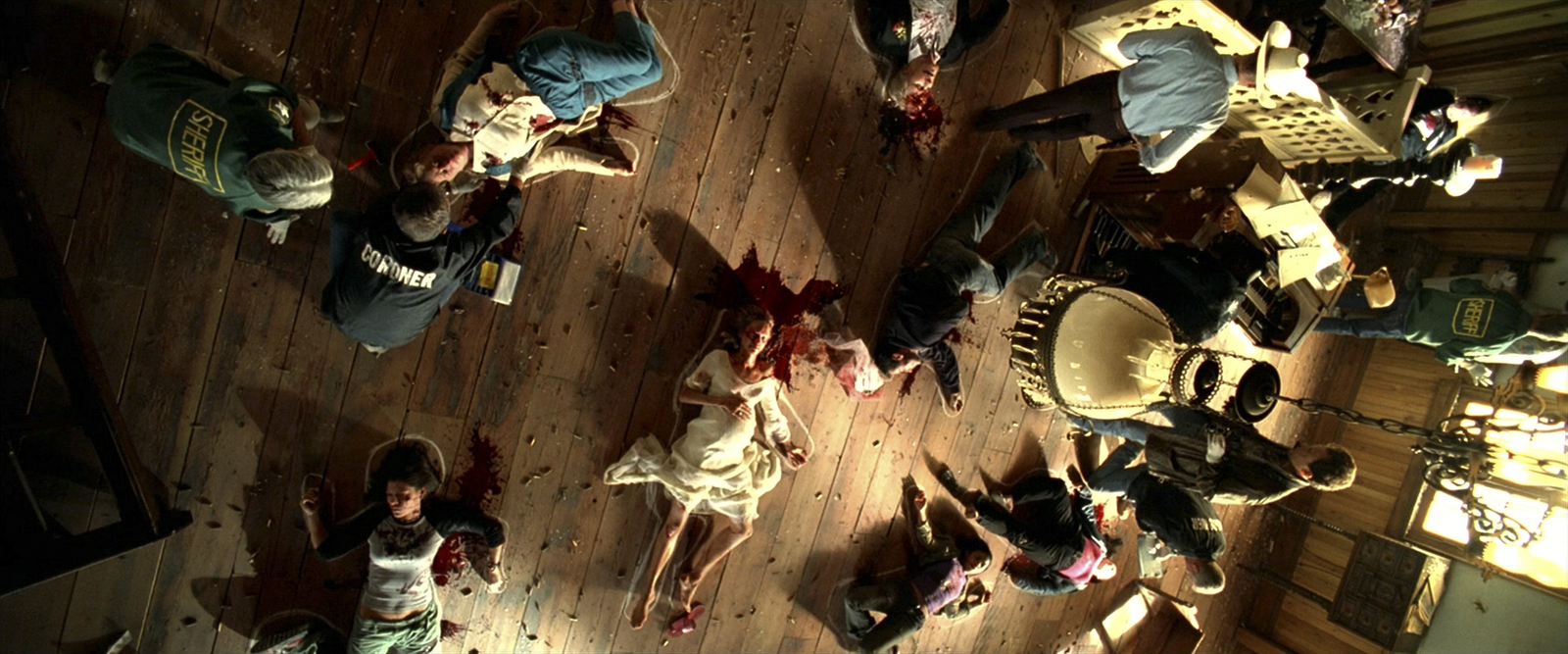 a group of people standing around a wooden floor