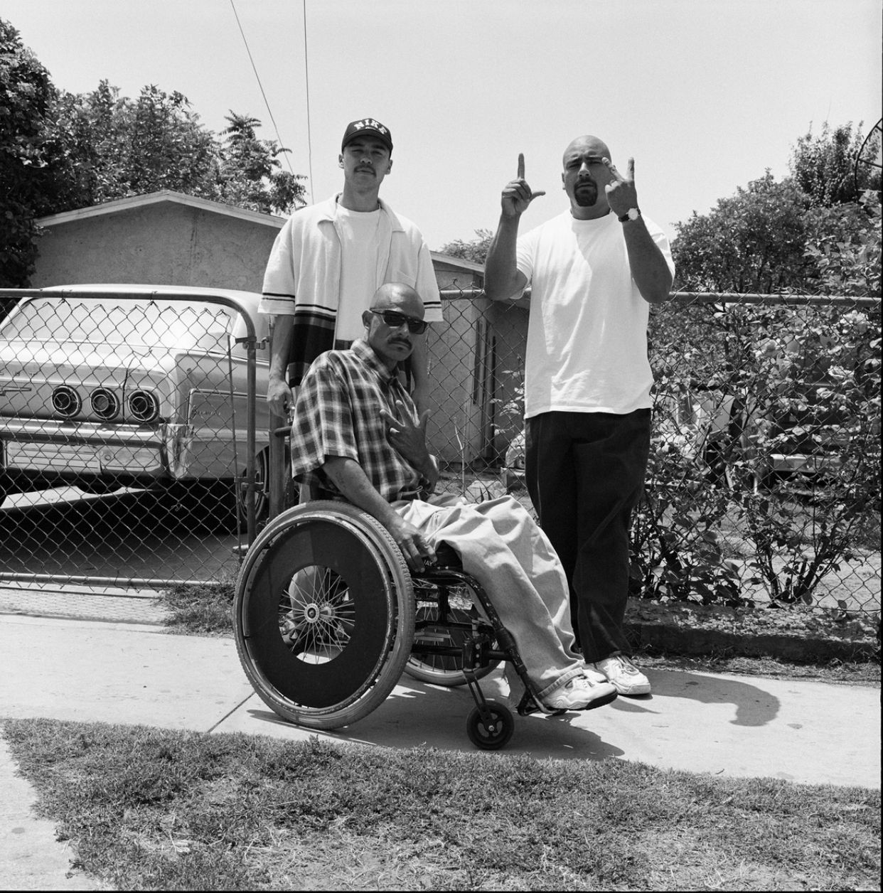 a man in a wheel chair giving a thumbs up