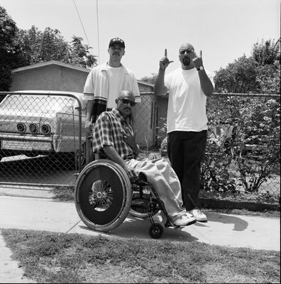 a man in a wheel chair giving a thumbs up