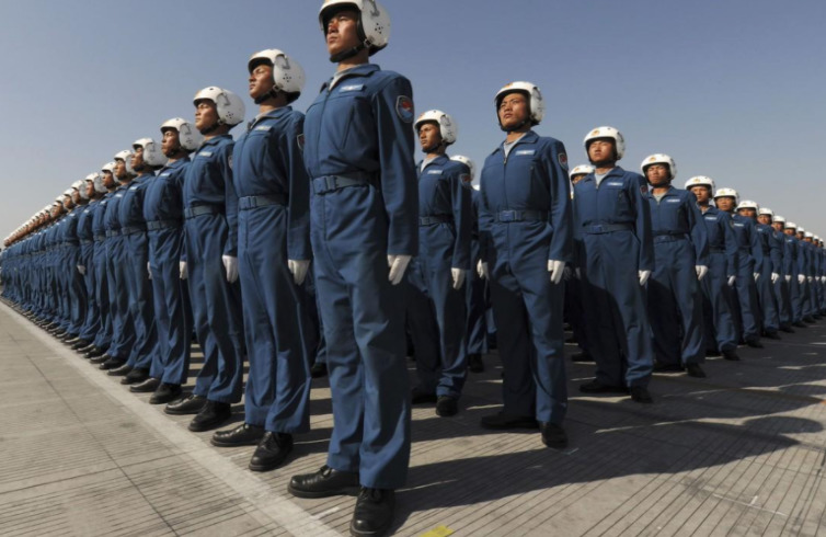 a group of men in blue uniforms standing next to each other