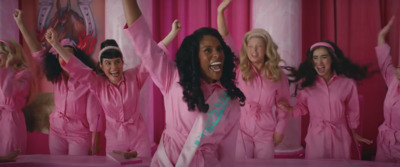 a group of women in pink pajamas posing for a picture