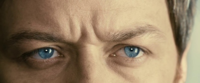 a close up of a man with blue eyes