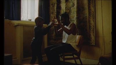 a man and a young boy in a room