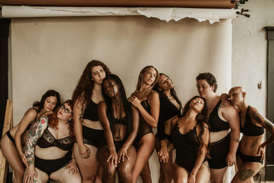 a group of women in bathing suits posing for a picture