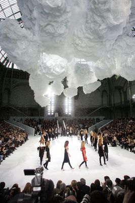 a group of people walking down a runway