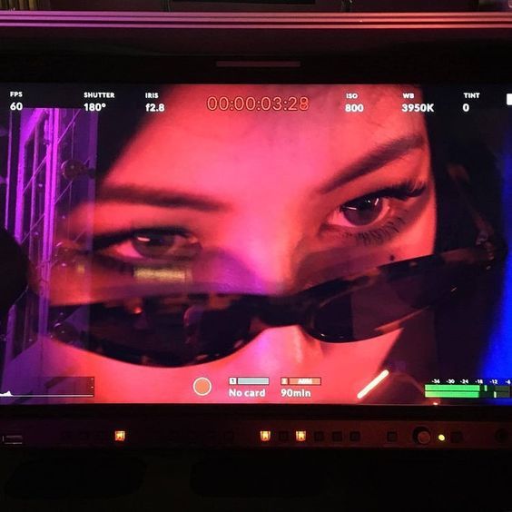 a close up of a monitor with a woman's face