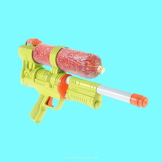 a toy gun with a sausage on top of it