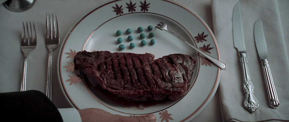 a steak on a plate with a fork and knife