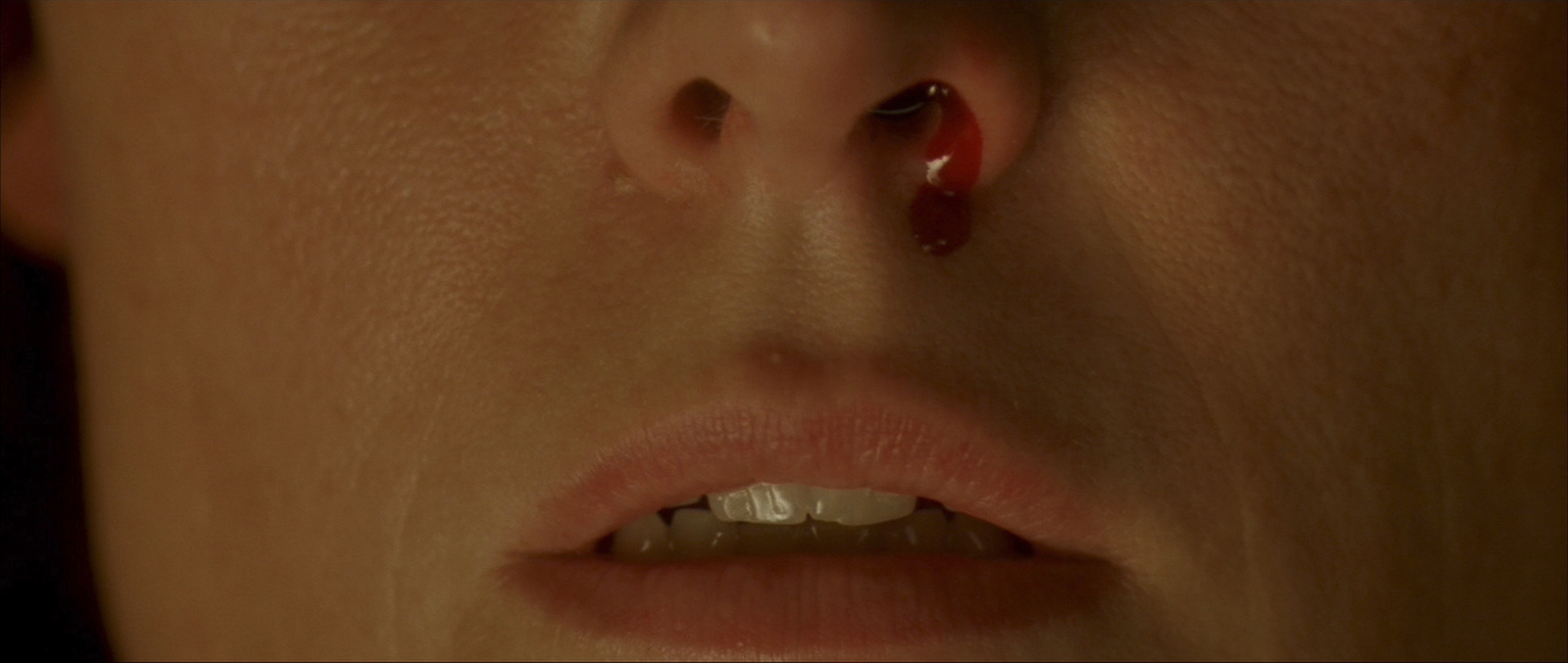 a close up of a person with a nose piercing