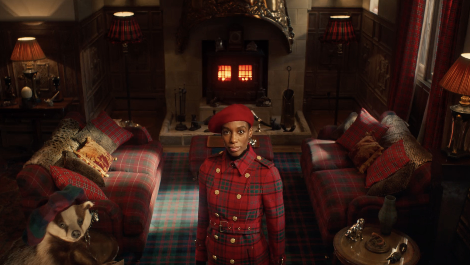 a man in a red hat standing in a living room