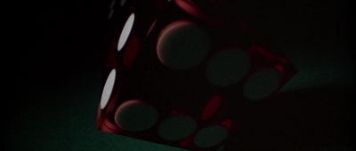 a close up of a dice in the dark