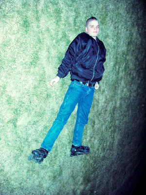 a man on a skateboard in the grass