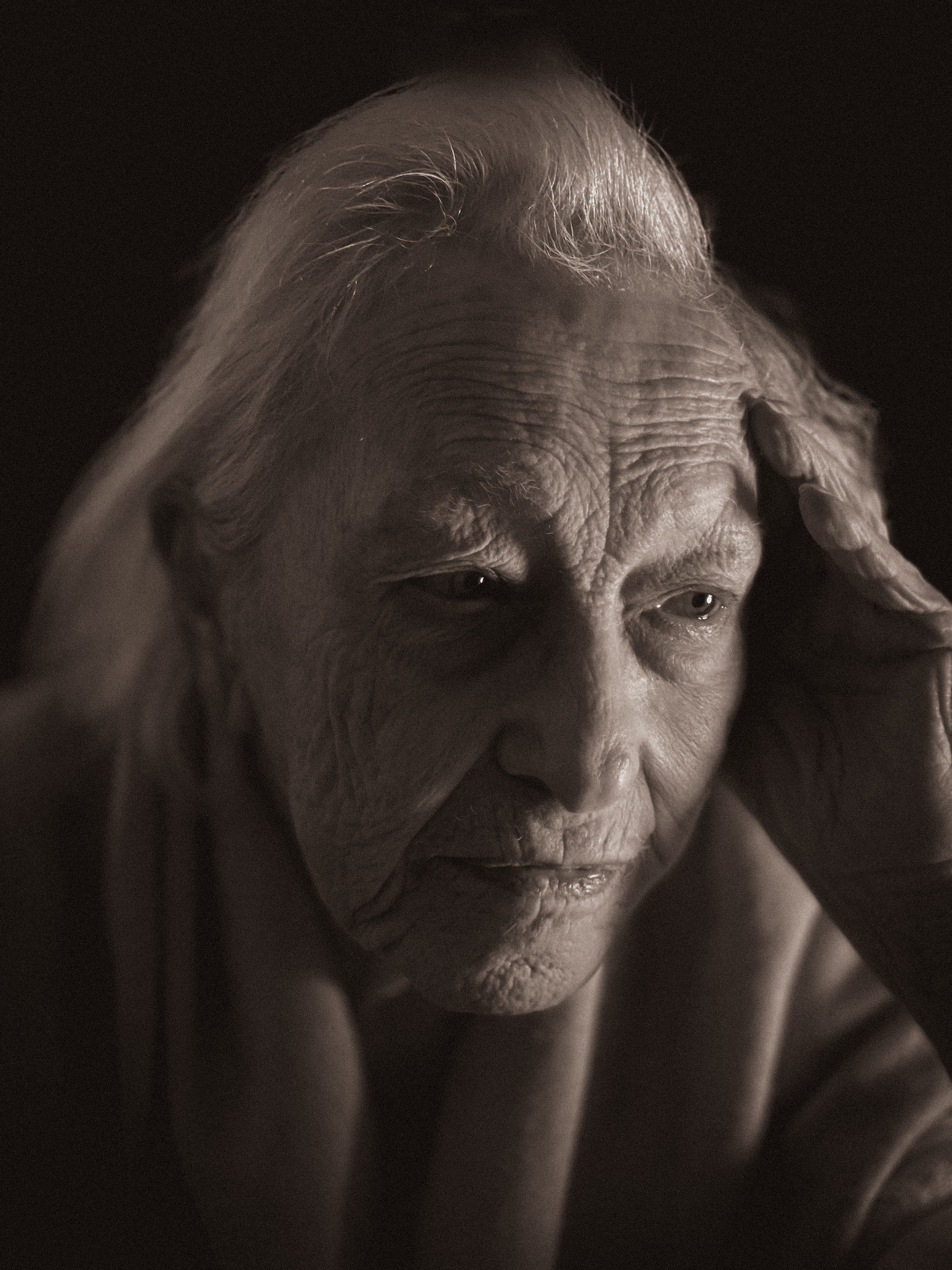 a black and white photo of an old woman