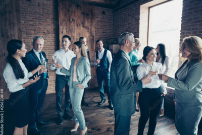 a group of people standing around each other