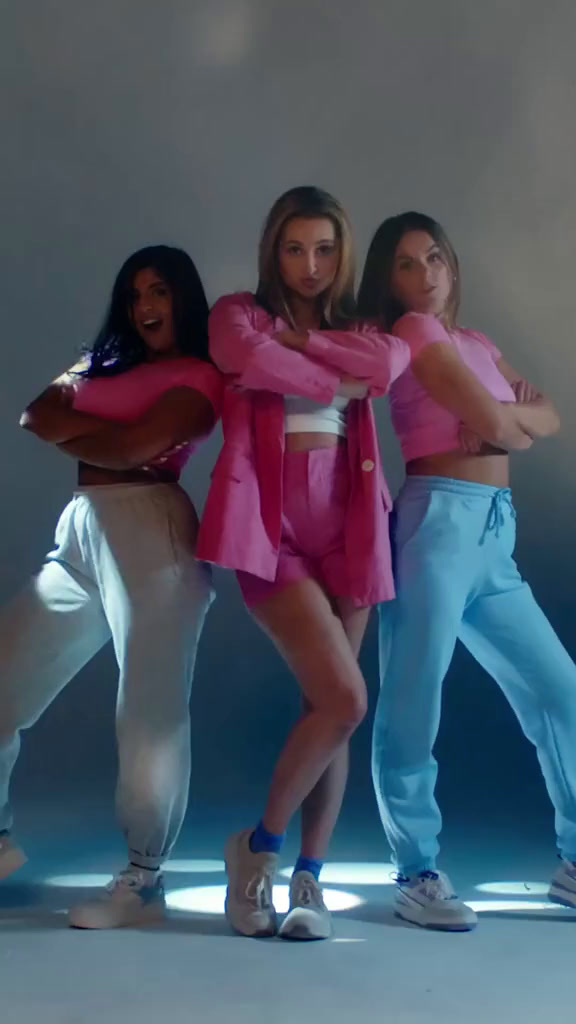 a group of young women standing next to each other