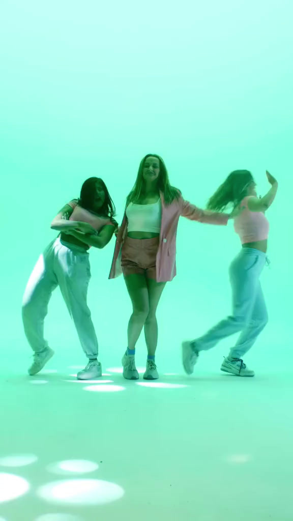 a group of young women standing next to each other