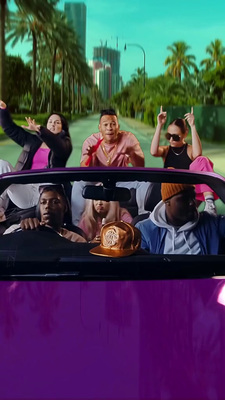 a group of people riding in the back of a purple car