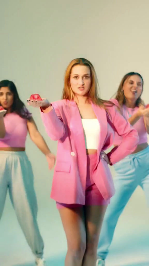 a group of young women standing next to each other