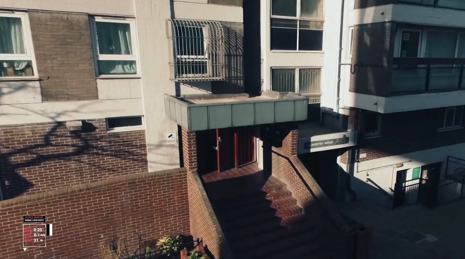 an aerial view of a building with a staircase leading up to it