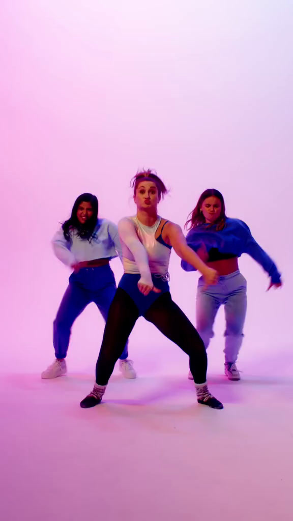 a group of young women standing next to each other