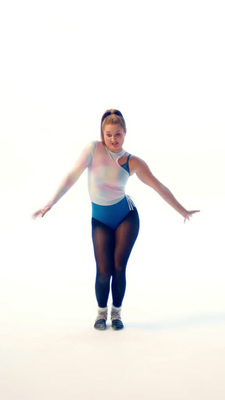 a woman in a blue and white leotard