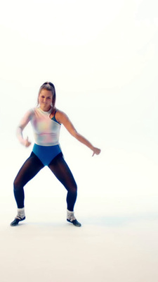 a woman in a blue and white leotard