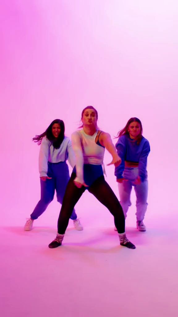 a group of young women standing next to each other