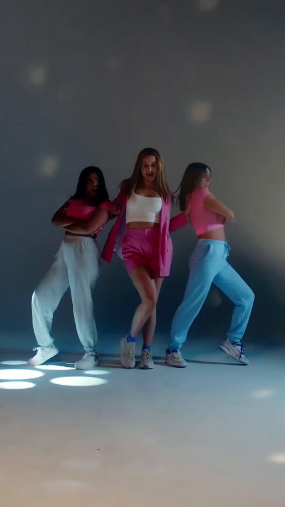 a group of young women standing next to each other