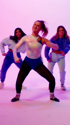 a group of young women standing next to each other