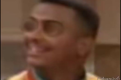 a blurry photo of a man with glasses